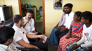 Rahul Gandhi interacts with the bereaved family