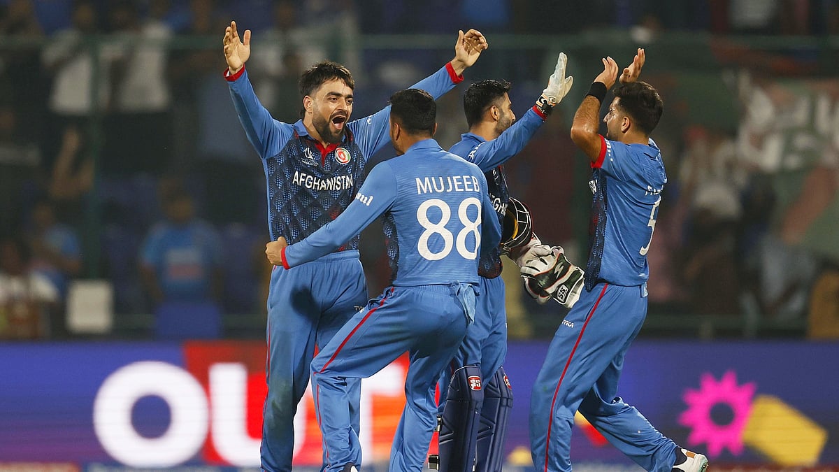 Rashid Khan of Afghanistan celebrates a wicket against England on 15 October in Delhi (photo: Getty Images)