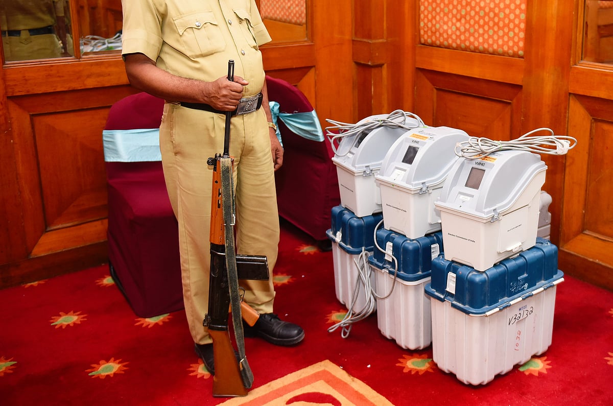 A policeman guards Voter-Verified Paper Audit Trail (VVPAT) machines during a demo session by the ECI in Bengaluru (photo: Getty Images)