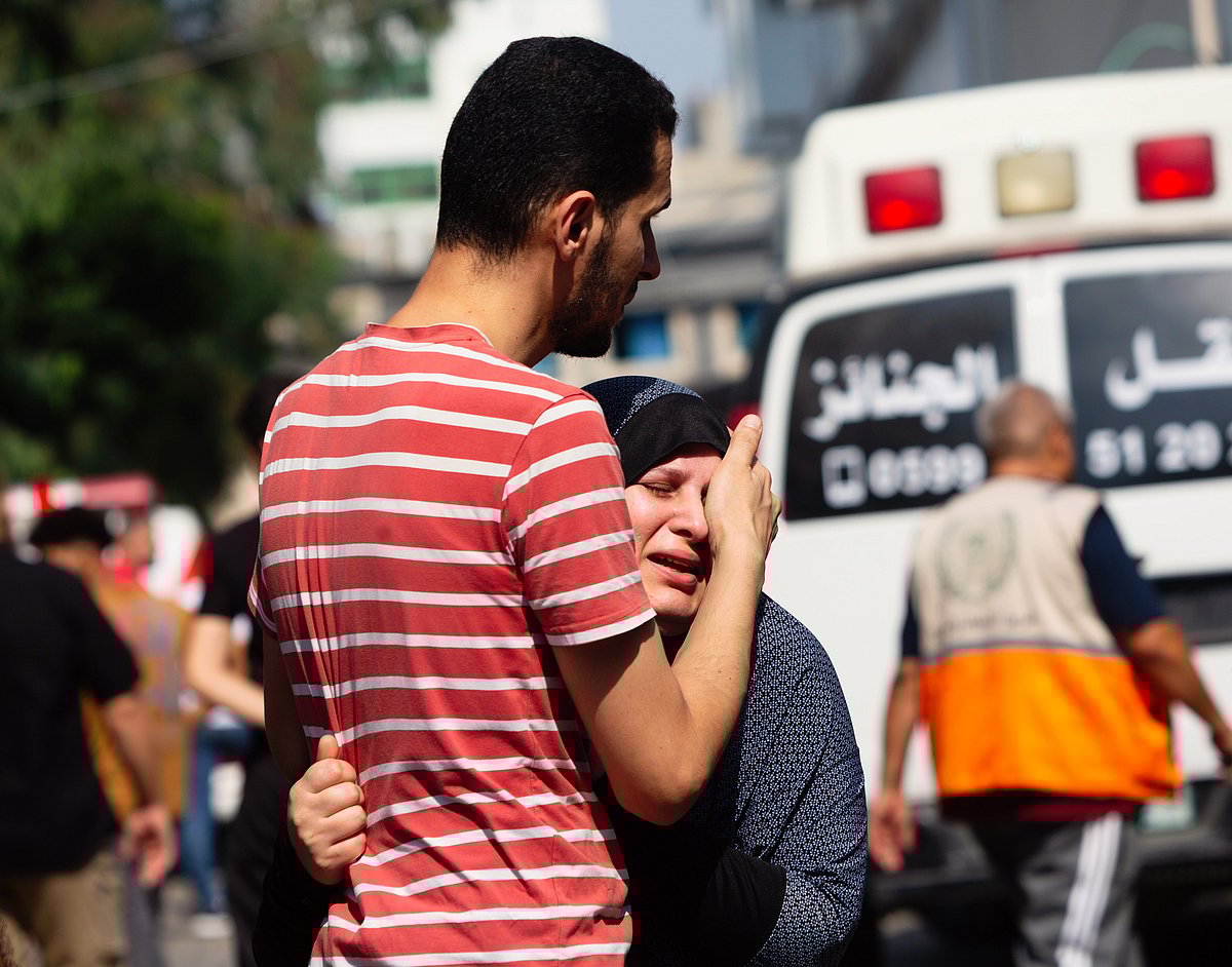 Grieving relatives before a funeral procession at Al-Shifa Hospital (photo: Getty Images)
