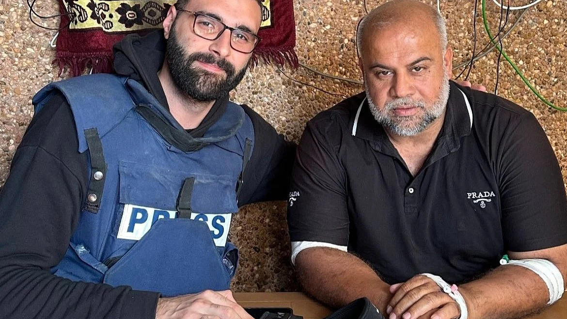 Palestinian photojournalist Motaz Azaiza (left) with Al-Jazeera correspondent Wael Dahdouh, who was reporting live when he received a call that his wife, children and grandchildren at home were killed in an Israeli strike (photo: @azaizamotaz/X)