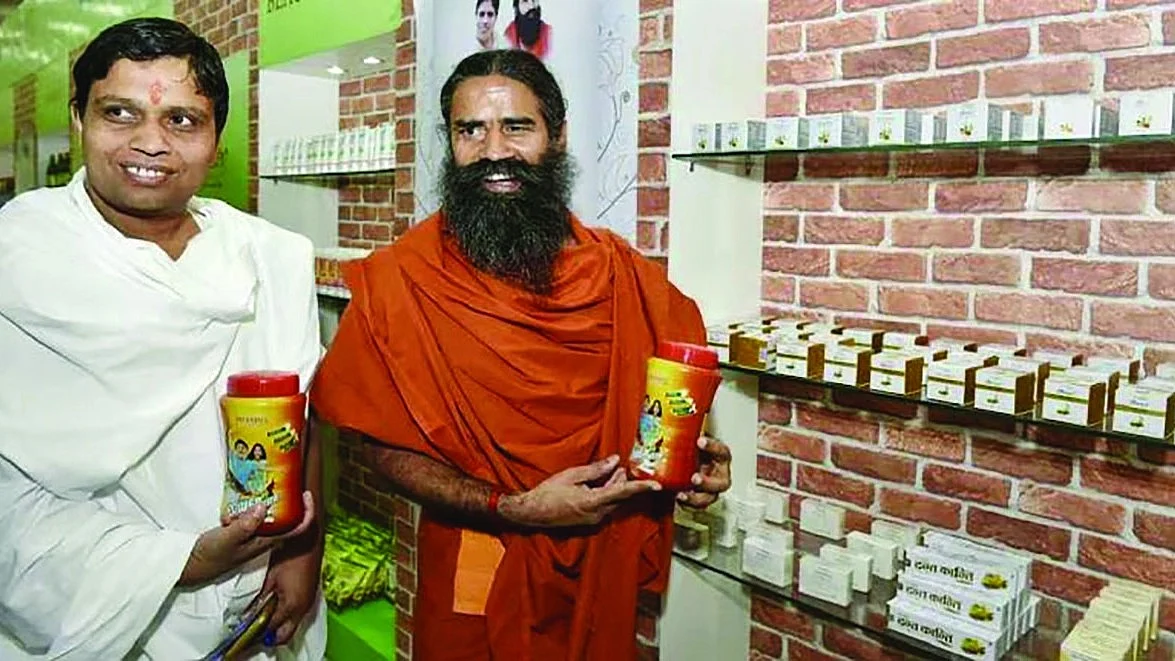 Ramdev’s close associate Acharya Balkrishna (in white) set up Corrupack in 2009 to manufacture packaging material; its real business however is real estate. (Photo: Getty)