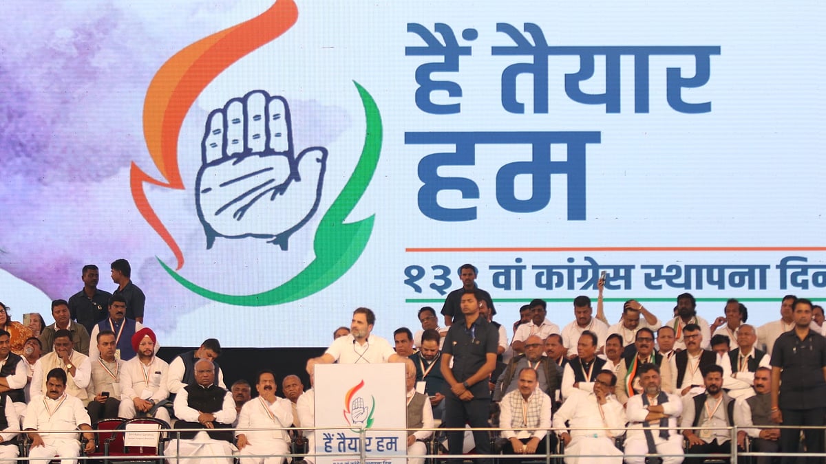 Congress MP Rahul Gandhi speaks before a backdrop of an updated Congress logo, open palm in tricolour flame with the legend 'Hain Taiyaar Hum (We Are Ready)', at a rally on the party's 139th Foundation Day in Nagpur (photo: Sunny Shende)  