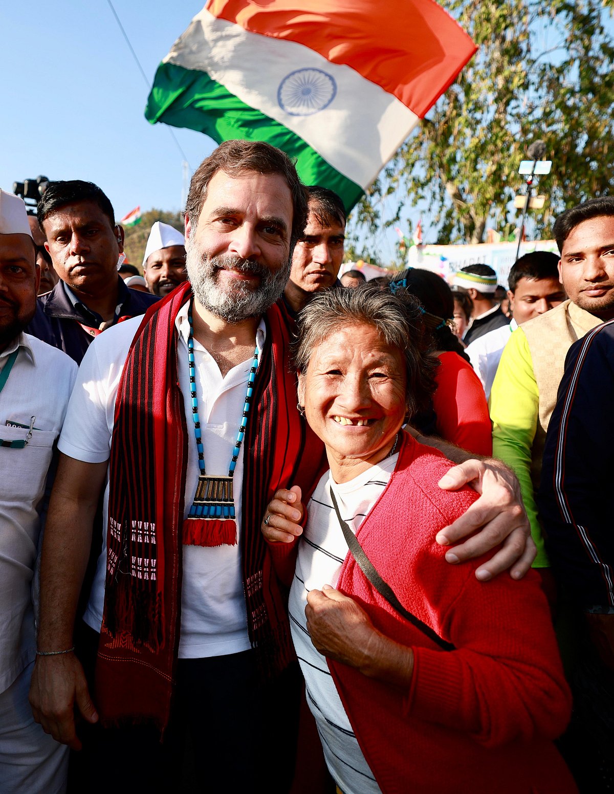 An older Nyay Yoddha in Arunachal Pradesh with Gandhi and the National flag