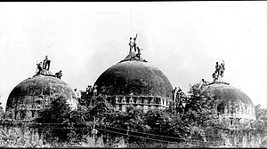 A scene from the demolition of the Babri Masjid on 6 December 1992 (Getty Images)