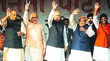 Blurry blast from the past: L.K. Advani (centre) with Atal Bihari Vajpayee and a few other familiar faces in Ranchi, 2014 (photo: @_LKAdvani/X)