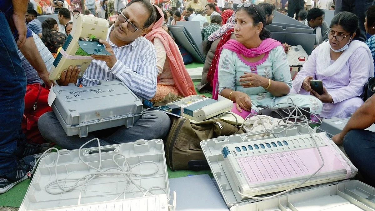 File photo of officials examining EVMs before polling in UP’s Ghaziabad in May 2023