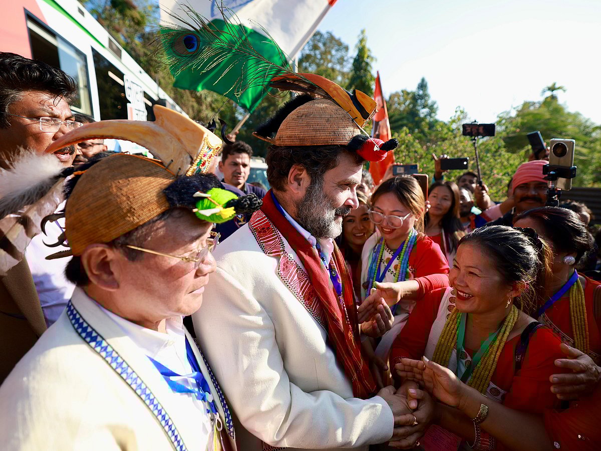 Locals greet the Congress leader with a traditional scarf and a Nyishi headdress, surmounted by a hornbill beak