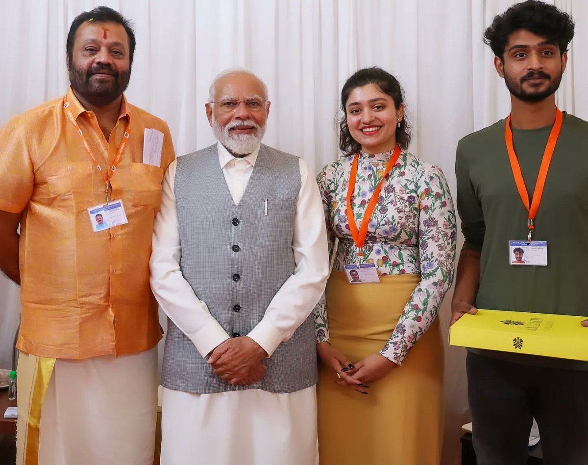 Actor Suresh Gopi and family with PM Narendra Modi (photo: @TheSureshGopi/X)