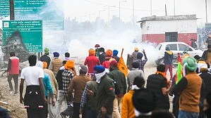 Police have used tear gas, water cannon to disperse agitating farmers. (photo: IANS)