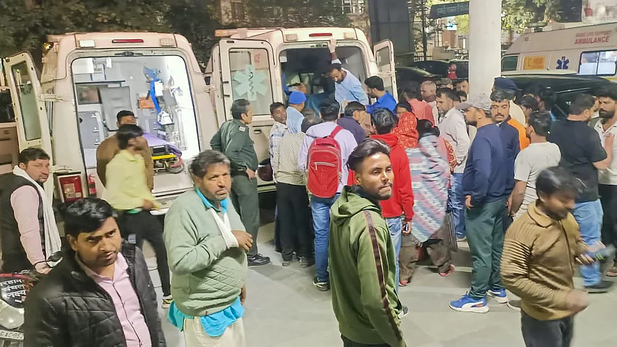 Relatives gather outside a hospital in Rewari district on 16 March (photo: PTI)