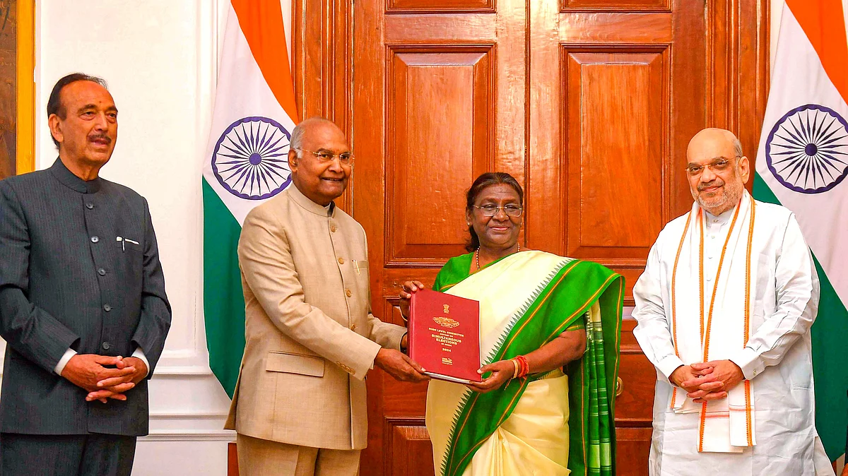 Ram Nath Kovind presents the report to President Droupadi Murmu with fellow committee members Union home minister Amit Shah (far right) and Ghulam Nabi Azad (photo: PTI)