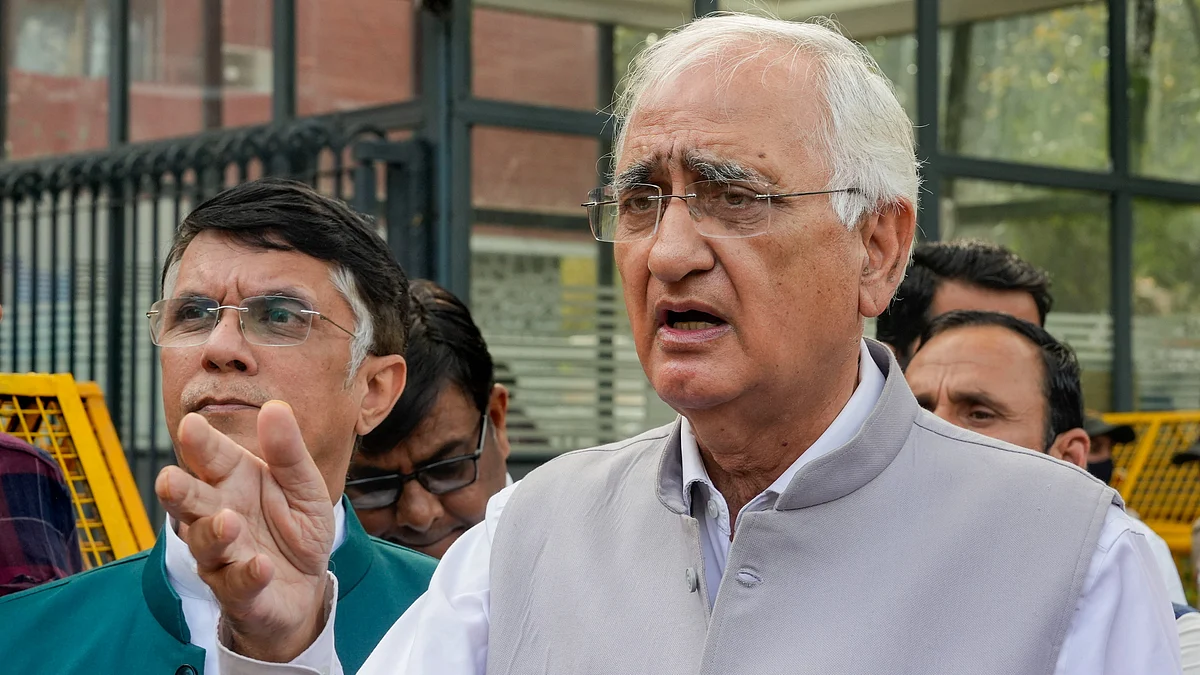 Congress leaders Salman Khurshid and Pawan Khera in New Delhi on 2 April (photo: PTI)