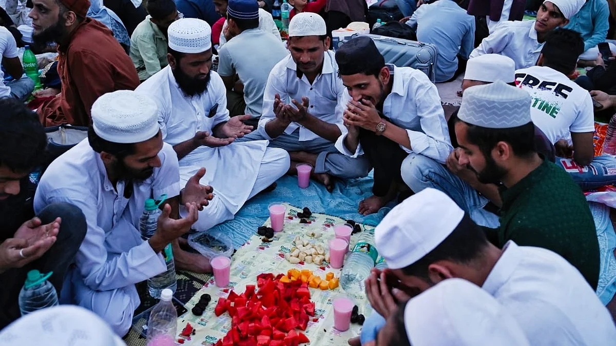 Devotees offer prayers before breaking their fast