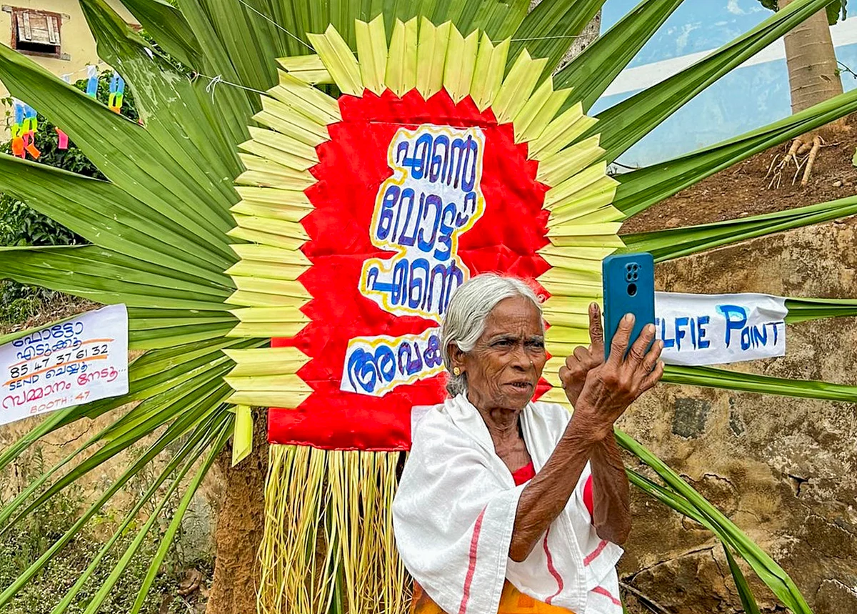 An elderly voter clicks a selfie after casting her vote in Wayanad, Kerala (photo: @Ceokerala/X)