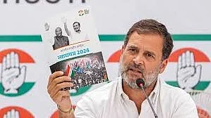 Rahul Gandhi shows the Congress manifesto for 2024 Lok Sabha elections