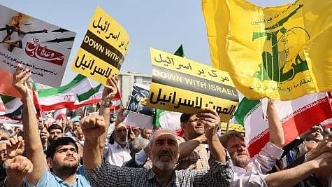 Crowds hold up 'Down with Israel' placards in a rally in Iran's capital city, Tehran (photo: IANS)