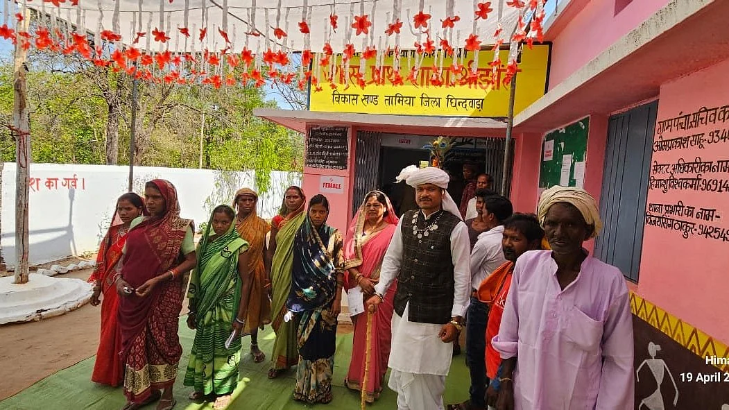 Voters gathered outside a booth in Chhindwara, which saw the highest voting turnout in phase I in Madhya Pradesh (@CEOMPElections/X)