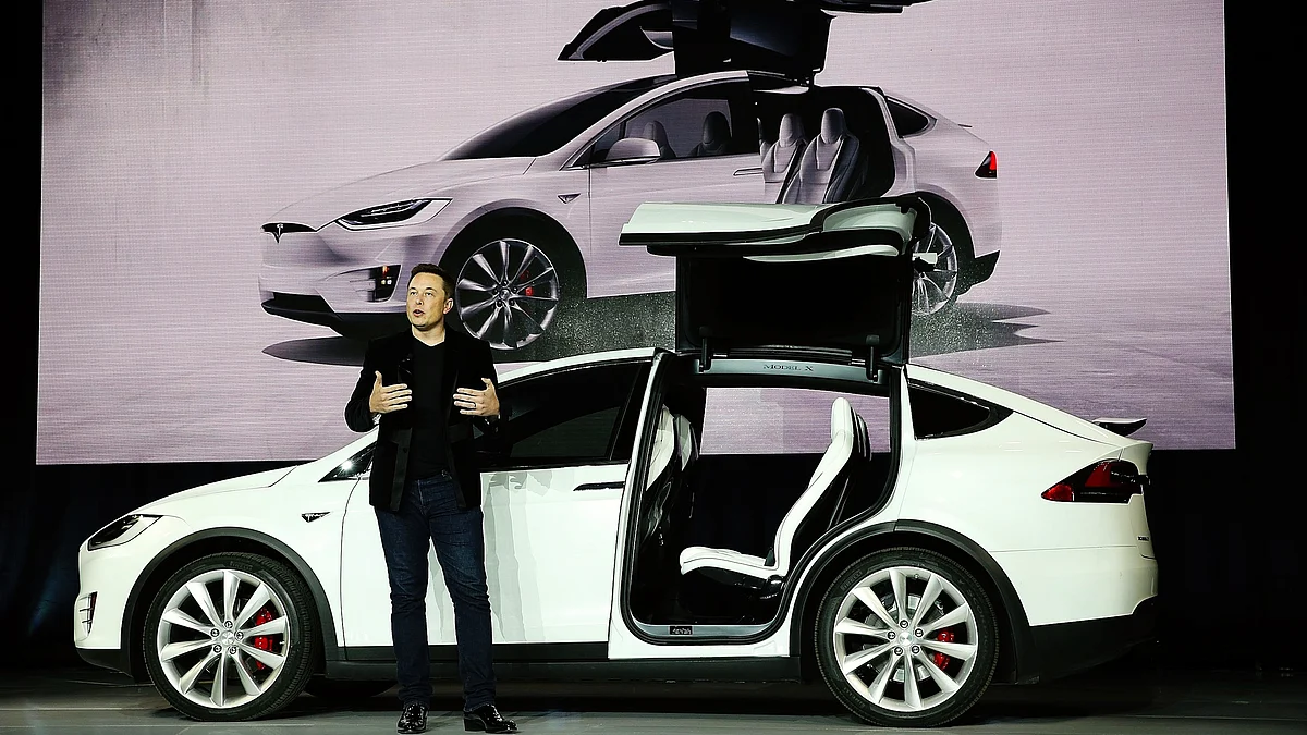 Elon Musk with a Tesla Model X Crossover SUV (file photo)