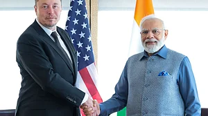 The last time Elon Musk (left) met India's prime minister Narendra Modi (right), he declared himself "a fan of Modi" (photo courtesy  @VivekSi85847001/X)