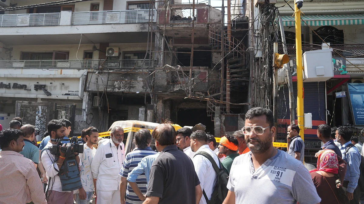 People gather outside the children's hospital in New Delhi on 26 May (photo: PTI)