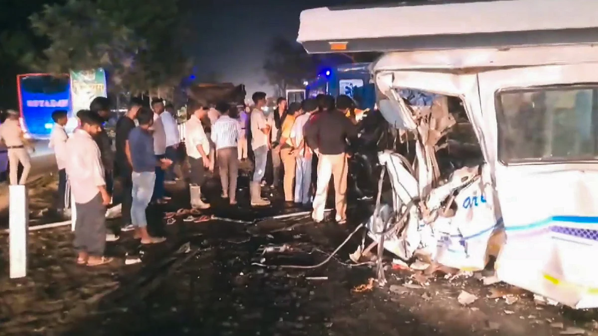 People gather near the damaged vehicle in Ambala on 24 May (photo: PTI)