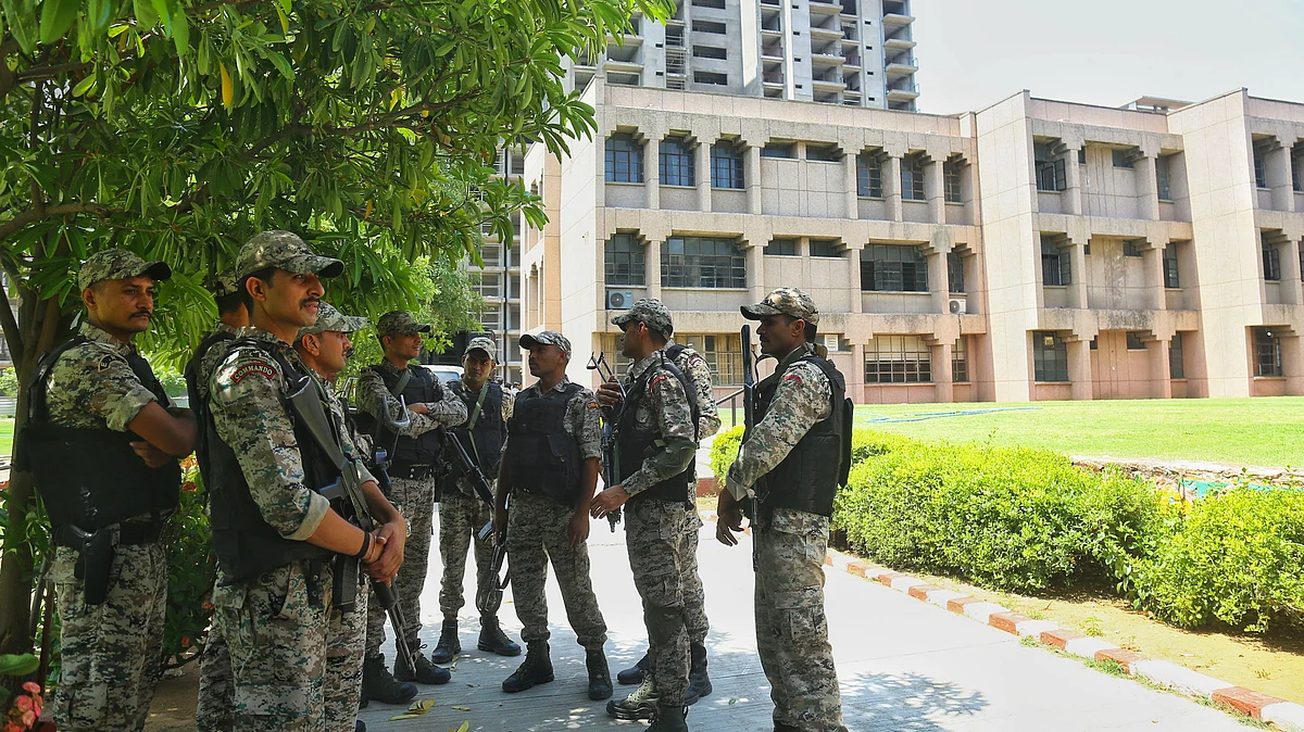 Security personnel stand guard outside Jaipuria school on 13 May