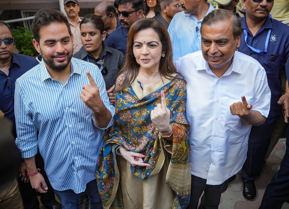 Industrialist Mukesh Ambani with wife Nita and son Akash at a polling booth in Mumbai