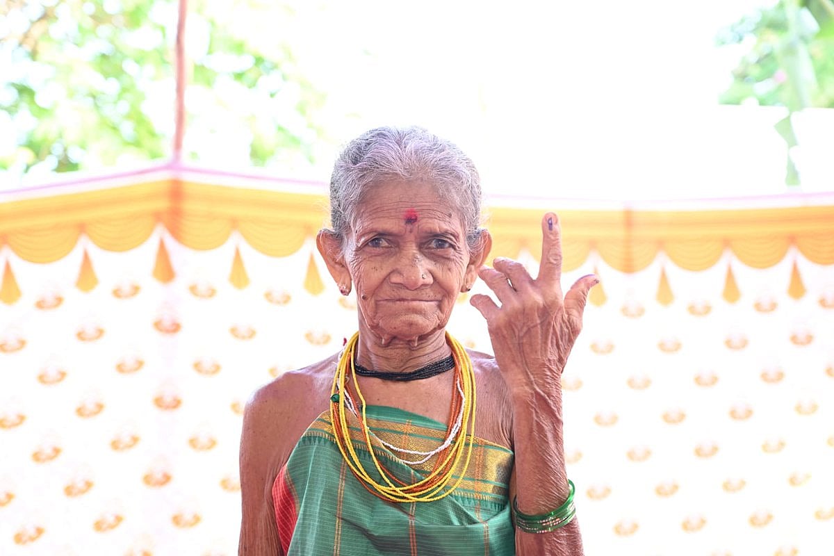 An 85-year-old voter holds up her inked finger in Karwar, Karnataka (photo courtesy @ceo_karnataka/X)
