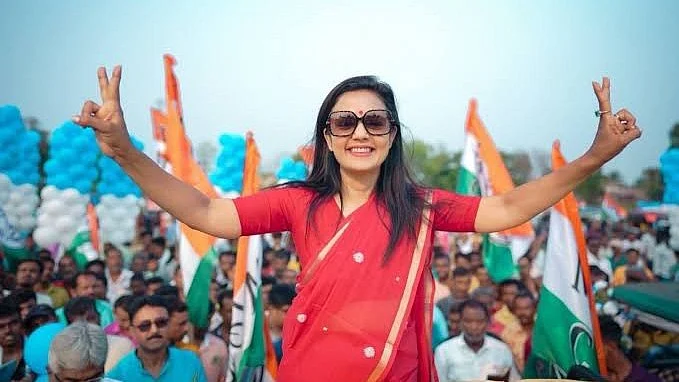 Trinamool MP Mahua Moitra at a rally, a lone woman surrounded by menwomen (photo: @MahuaMoitraFans/X)