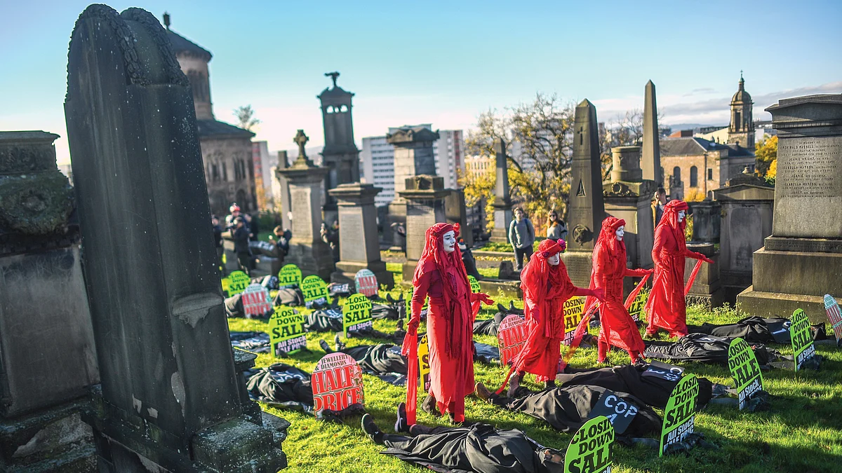 Extinction Rebellion activists hold a funeral for COP26 at the Necropolis, Glasgow, UK, 13 November 2021
