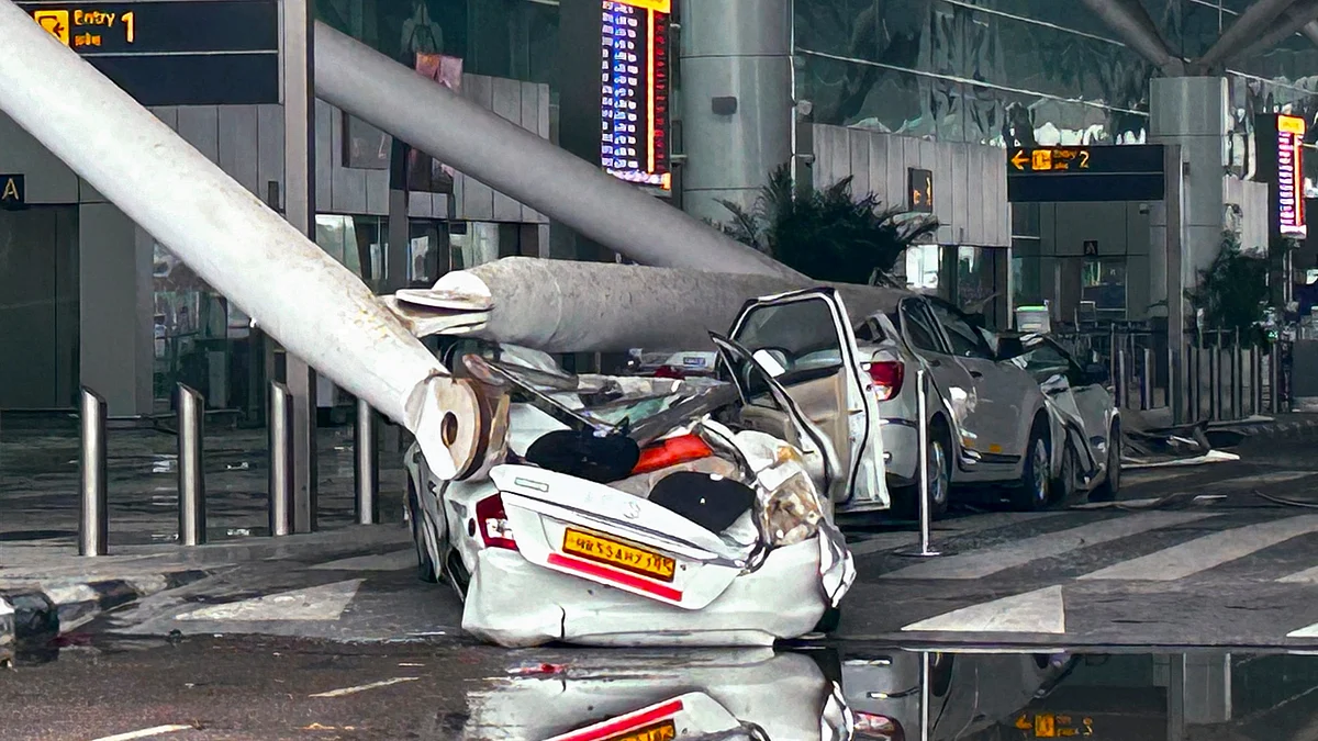 Damaged vehicles at Terminal 1 of IGI airport in New Delhi on 28 June (photo: PTI)