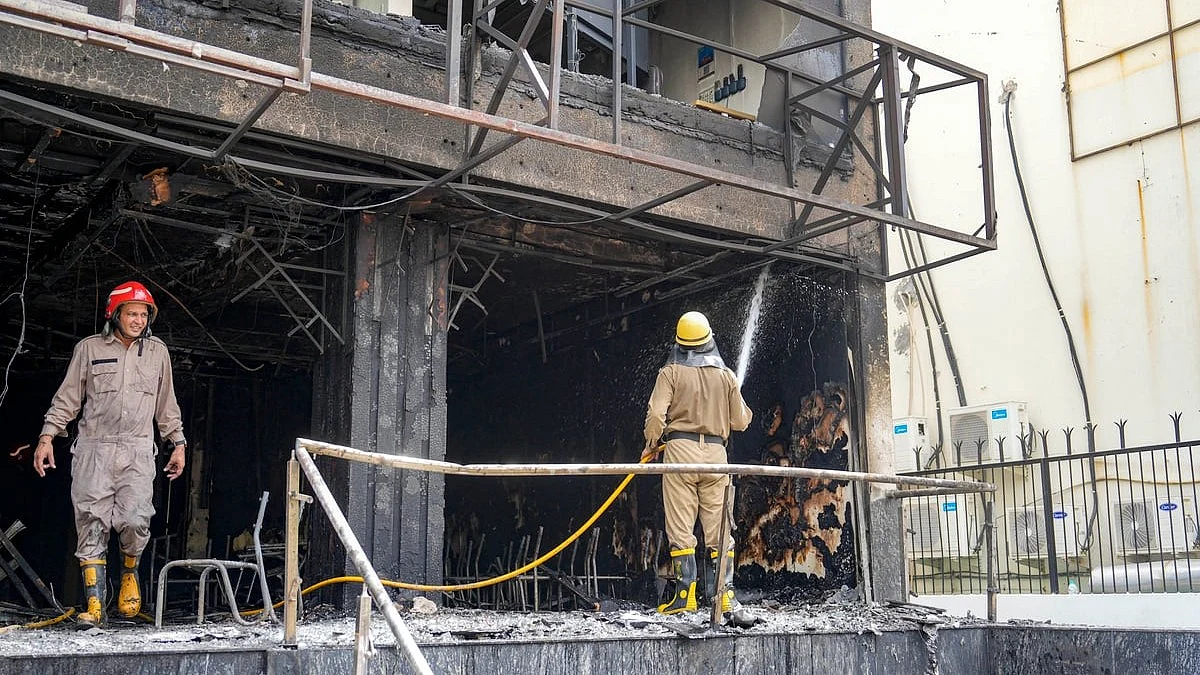 Firefighters douse a fire at an eye hospital in Lajpat Nagar, New Delhi (photo: Shahbaz Khan/PTI)