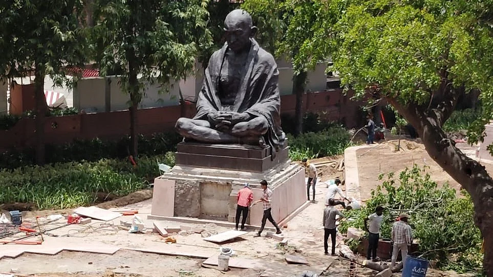 The Mahatma sits amidst debris, like Baba Ambedkar and Shivaji, uprooted (photo: @Jairam_Ramesh/X)
