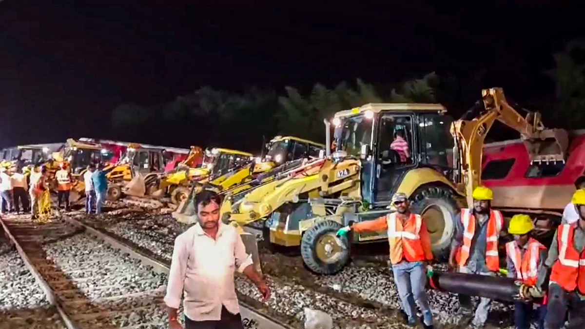 Bulldozers clear the railway track in in Gonda on 19 July (photo: PTI)