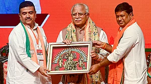 Union minister M.L. Khattar (C) with Adhikari (L) and Union MoS Sukanta Majumder in Kolkata (photo: PTI)