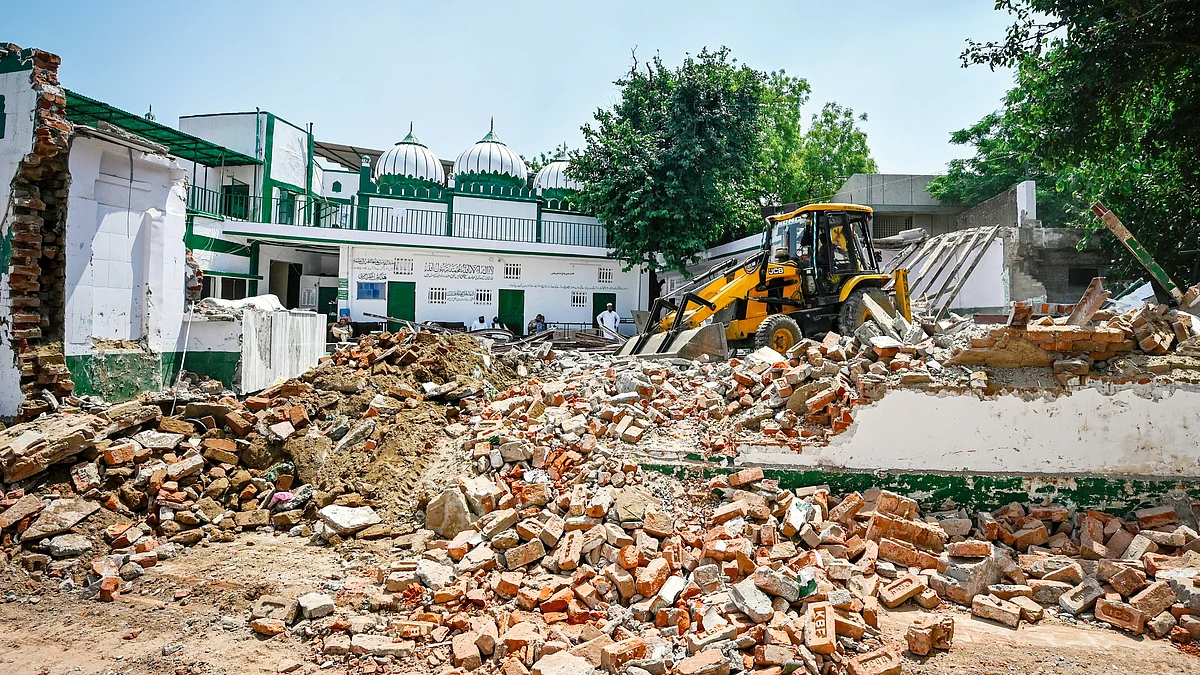 Part of a mosque is demolished by NDMC in New Delhi’s Bengali Market, April 2023