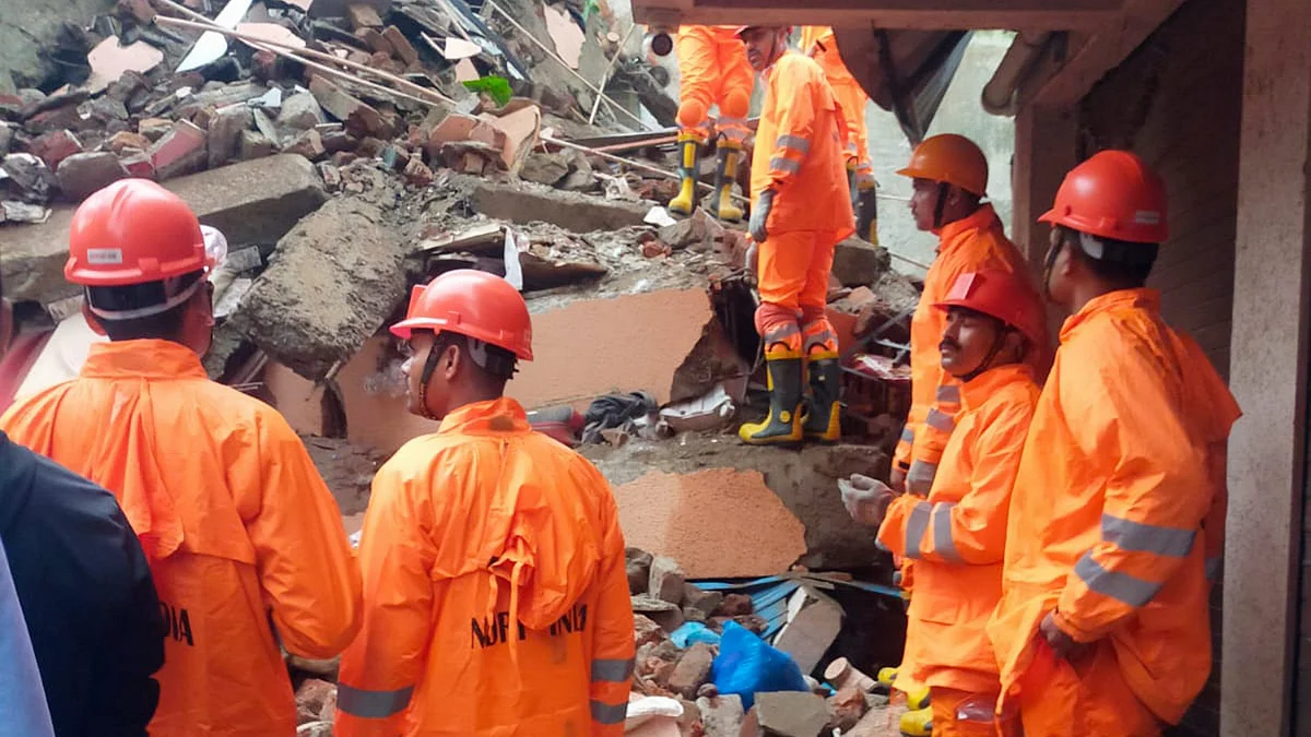 Rescue operation underway after a four-storey building collapsed, at Belapur area (photo: PTI)