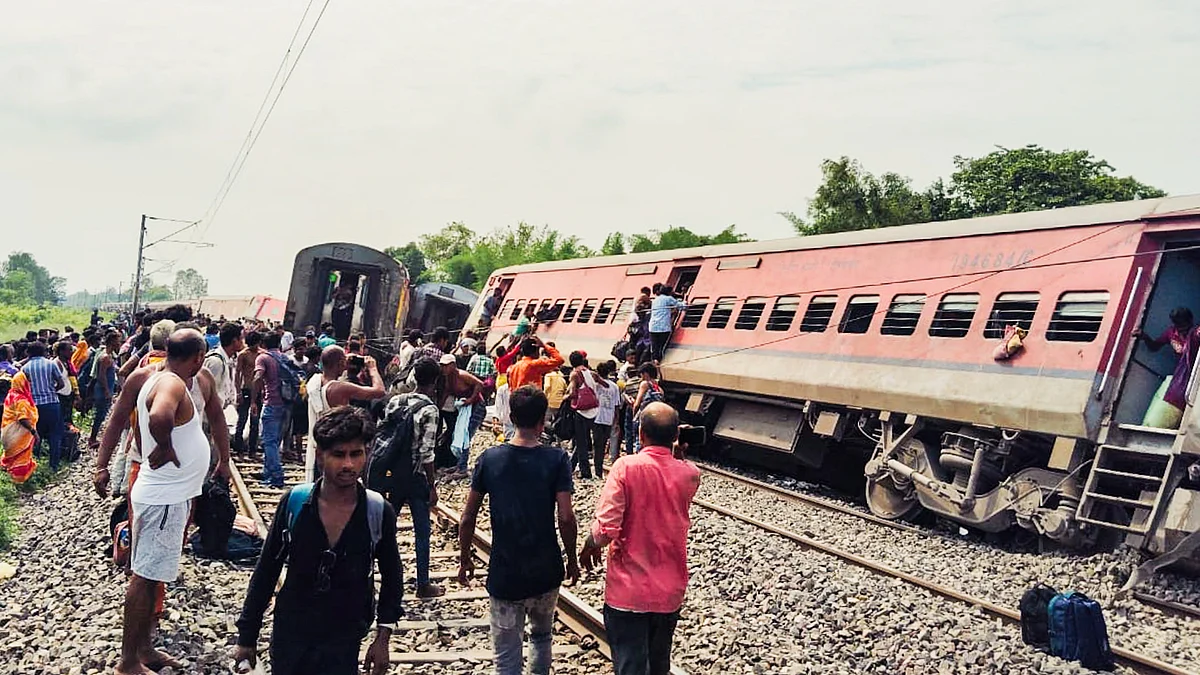 Passengers and locals near the derailed coaches in Gonda district (photo: PTI)