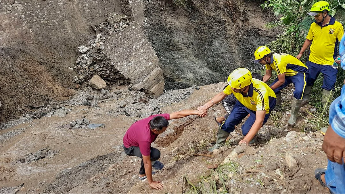 NDRF officials conduct rescue operation in Dehradun on 1 August (photo: PTI)