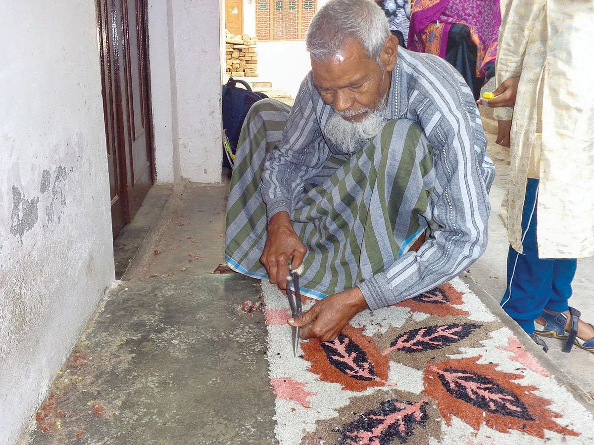 Zahiruddin practises the craft of gultarash, the finetuning of carpet designs