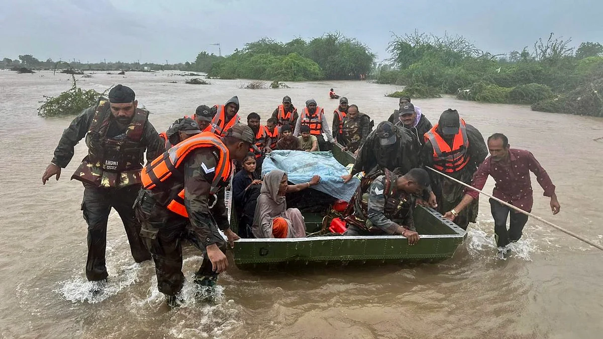 Army personnel during a rescue operation at flood-hit areas of Jamnagar, Rajkot and Dwarka