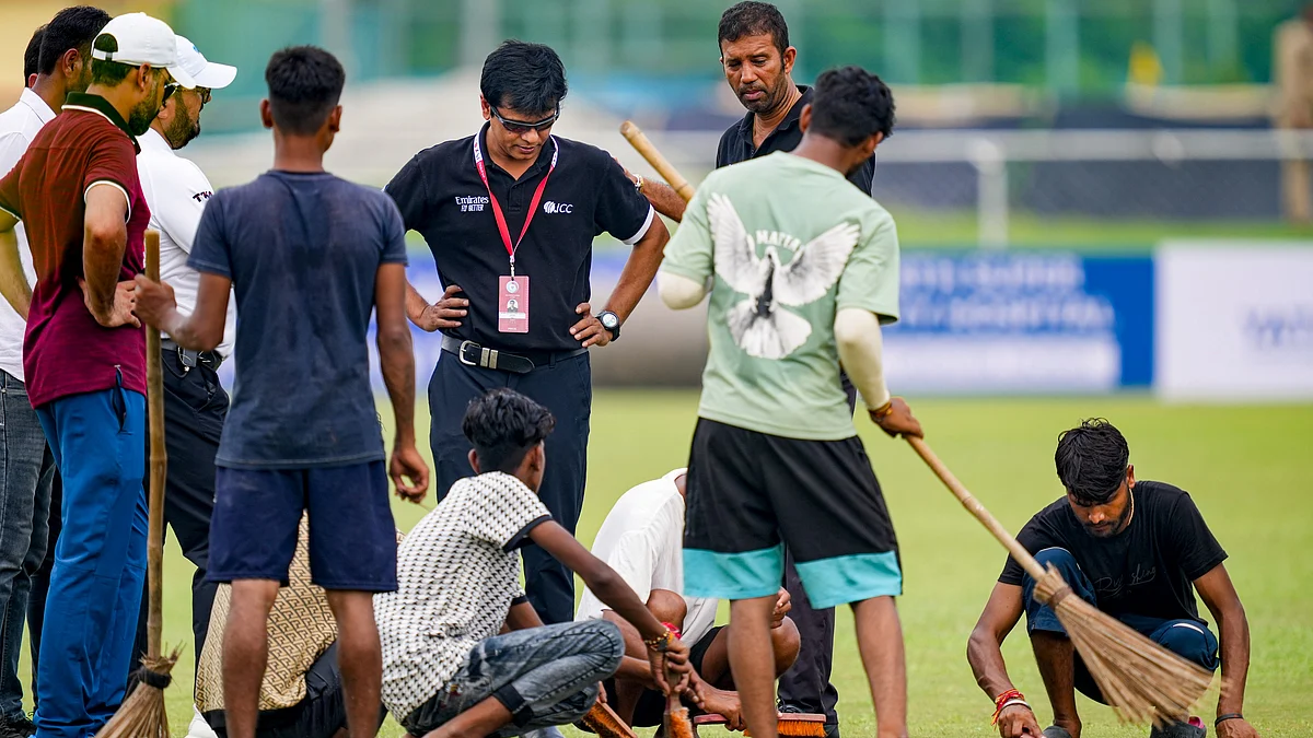 Ground staff busy working at Noida stadium on 9 September (photo: PTI)
