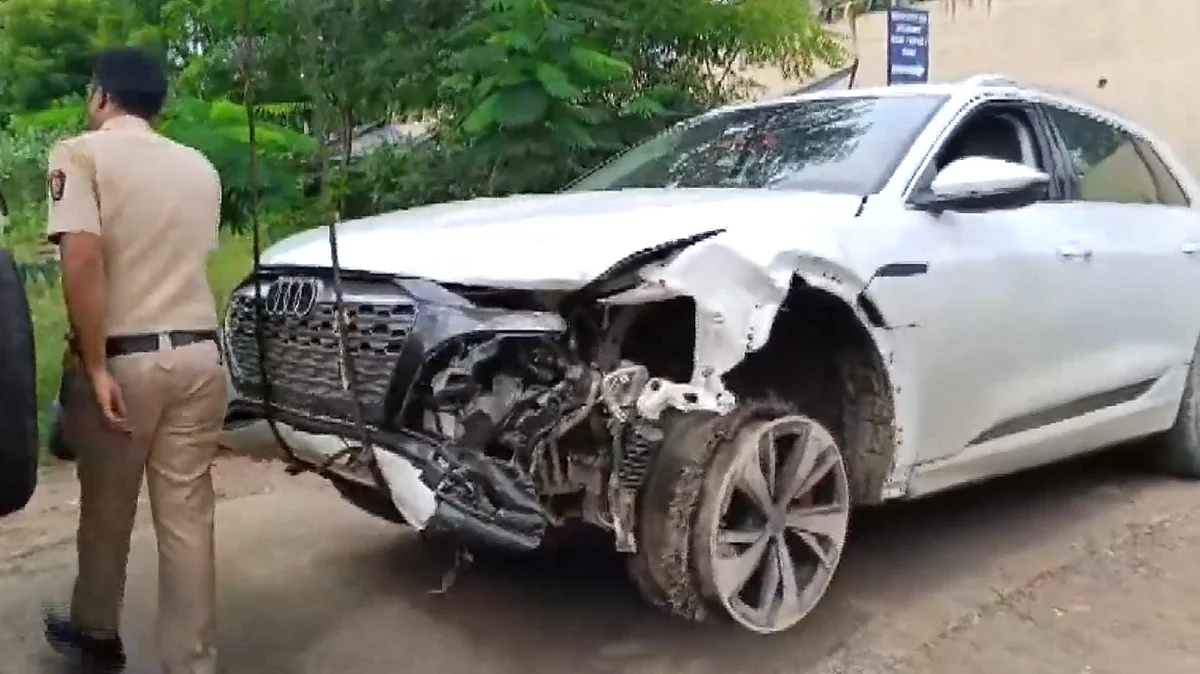 Nagpur: A police personnel near the damaged Audi owned by Chandrashekhar Bawankule's son