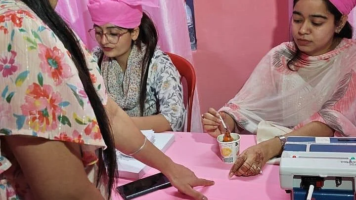 J&K: Voters casting their votes at a woman managed polling station, exclusively managed by female staff