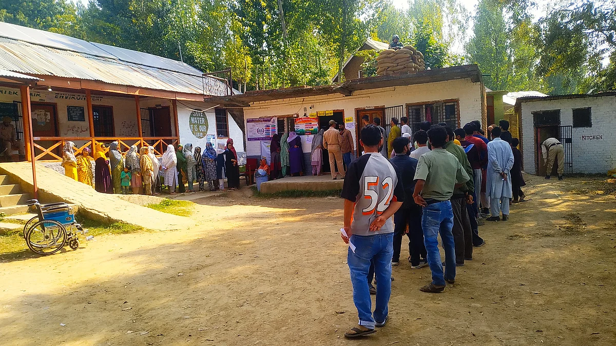 Voters stand in line in Wusaan, 17-Kangan, Ganderbal