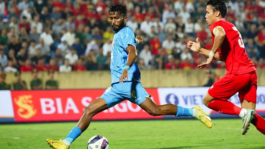 India winger Farukh Chowdhury tries to beat a Vietnam rival during their friendly on Saturday
