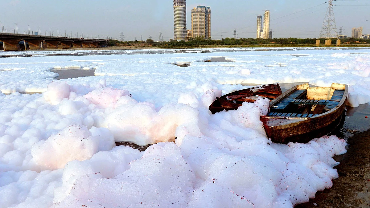 Thick layers of frothy foam in the Yamuna at Kalindi Kunj in Delhi