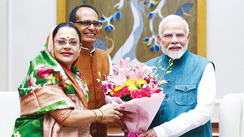 Shivraj Singh Chouhan and wife Sadhana with PM Narendra Modi