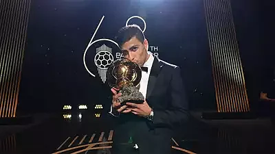 Rodri strikes a pose with his Ballon d'Or trophy in Paris